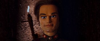 Movie still from “Team America: World Police” (2004), directed by Trey Parker – A doll of a man wearing a military uniform; Close Up shot, Low angle