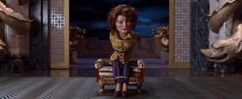 Movie still from “Team America: World Police” (2004), directed by Trey Parker – A woman sitting on a chair tied to a bench; Medium shot, High angle