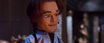 Movie still from “Team America: World Police” (2004), directed by Trey Parker – The face of a doll; Close Up shot, High angle