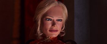 Movie still from “Team America: World Police” (2004), directed by Trey Parker – The face of a woman with blonde hair; Close Up shot, High angle