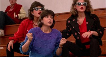 Movie still from “Teen Wolf” (1985), directed by Rod Daniel – A group of women sitting on a bench; Medium shot, Low angle
