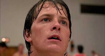 Movie still from “Teen Wolf” (1985), directed by Rod Daniel – A person with wet hair; Close Up shot, Low angle
