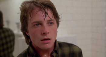 Movie still from “Teen Wolf” (1985), directed by Rod Daniel – A person wearing a plaid shirt; Close Up shot, Low angle