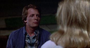 Movie still from “Teen Wolf” (1985), directed by Rod Daniel – A man and a woman talking to each other; Close Up shot, Over the shoulder angle