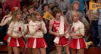 Movie still from “Teen Wolf” (1985), directed by Rod Daniel – A group of young women in red and white outfits; Medium shot, Low angle