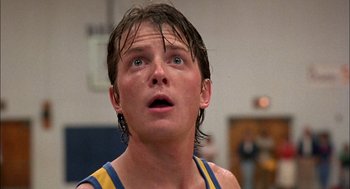 Movie still from “Teen Wolf” (1985), directed by Rod Daniel – A young man with wet hair looking surprised; Close Up shot, Low angle