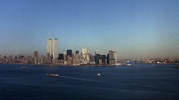Movie still from “Teenage Mutant Ninja Turtles” (1990), directed by Steve Barron – A view of a large city from the water; Extreme Wide shot, High angle