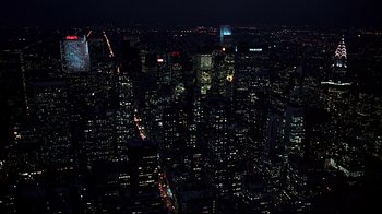 Movie still from “Teenage Mutant Ninja Turtles” (1990), directed by Steve Barron – A view of a city at night from a helicopter; Extreme Wide shot, High angle