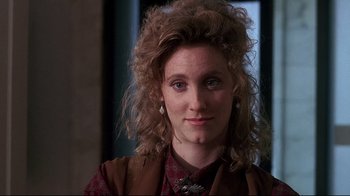 Movie still from “Teenage Mutant Ninja Turtles” (1990), directed by Steve Barron – A person with long hair; Close Up shot, Over the shoulder angle