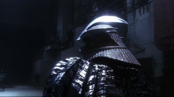 Movie still from “Teenage Mutant Ninja Turtles” (1990), directed by Steve Barron – The back end of a samurai armor; Close Up shot, Low angle