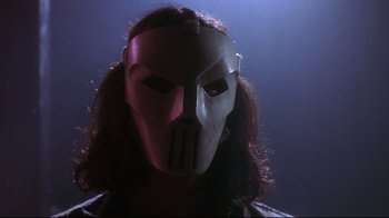 Movie still from “Teenage Mutant Ninja Turtles” (1990), directed by Steve Barron – A person's face wearing a mask; Close Up shot, Low angle