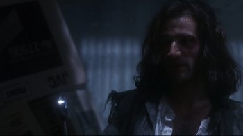 Movie still from “Teenage Mutant Ninja Turtles” (1990), directed by Steve Barron – A person with long dark hair; Close Up shot, Over the shoulder angle