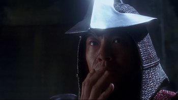 Movie still from “Teenage Mutant Ninja Turtles” (1990), directed by Steve Barron – A man wearing a hood and looking at the camera; Close Up shot, Low angle