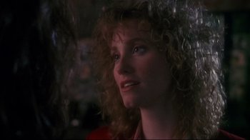 Movie still from “Teenage Mutant Ninja Turtles” (1990), directed by Steve Barron – A person with curly hair; Close Up shot, Over the shoulder angle