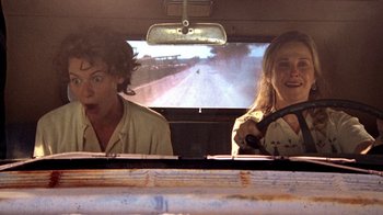 Movie still from “Temple Grandin” (2010), directed by Mick Jackson – Two people in the back seat of a car looking out of the window; Medium shot, Low angle