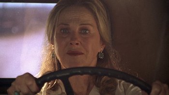 Movie still from “Temple Grandin” (2010), directed by Mick Jackson – A person sitting in a car with a steering wheel; Close Up shot, Low angle