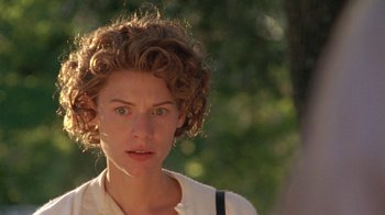 Movie still from “Temple Grandin” (2010), directed by Mick Jackson – A person with curly brown hair; Close Up shot, Over the shoulder angle