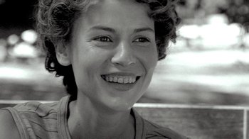 Movie still from “Temple Grandin” (2010), directed by Mick Jackson – A person smiling for the camera; Close Up shot, Low angle