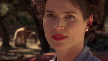 Movie still from “Temple Grandin” (2010), directed by Mick Jackson – A woman's face in a park setting; Close Up shot, Low angle