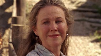 Movie still from “Temple Grandin” (2010), directed by Mick Jackson – A person smiling for the camera; Close Up shot, Low angle