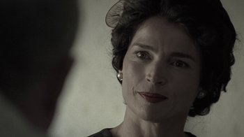 Movie still from “Temple Grandin” (2010), directed by Mick Jackson – A person wearing a dress; Close Up shot, Over the shoulder angle