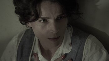 Movie still from “Temple Grandin” (2010), directed by Mick Jackson – A person with a hand on his chest; Close Up shot, High angle
