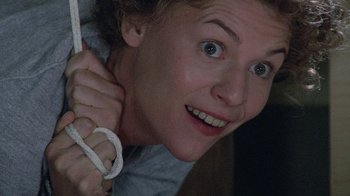 Movie still from “Temple Grandin” (2010), directed by Mick Jackson – A person holding a rope around their neck; Close Up shot, Overhead angle