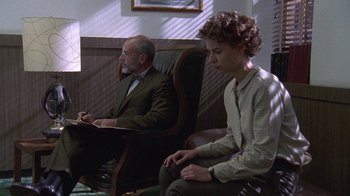 Movie still from “Temple Grandin” (2010), directed by Mick Jackson – A man and a boy sitting in a chair; Medium shot, Over the shoulder angle