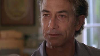 Movie still from “Temple Grandin” (2010), directed by Mick Jackson – A person wearing a gray shirt; Close Up shot, Low angle