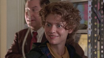 Movie still from “Temple Grandin” (2010), directed by Mick Jackson – A man and a woman smiling for the camera; Close Up shot, Over the shoulder angle