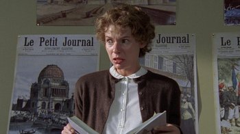 Movie still from “Temple Grandin” (2010), directed by Mick Jackson – A woman is holding a book in her hands; Close Up shot, Low angle