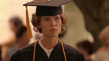 Movie still from “Temple Grandin” (2010), directed by Mick Jackson – A woman wearing a graduation cap and gown; Close Up shot, Over the shoulder angle