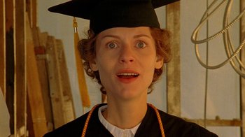 Movie still from “Temple Grandin” (2010), directed by Mick Jackson – A woman wearing a graduation cap and gown; Close Up shot, Low angle