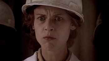 Movie still from “Temple Grandin” (2010), directed by Mick Jackson – A person wearing a hard hat; Close Up shot, Low angle