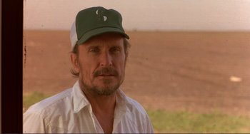 Movie still from “Tender Mercies” (1983), directed by Bruce Beresford – A person wearing a hat; Close Up shot, Over the shoulder angle