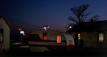 Movie still from “Tender Mercies” (1983), directed by Bruce Beresford – An old camper parked in the middle of the night; Extreme Wide shot, Low angle