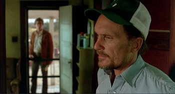 Movie still from “Tender Mercies” (1983), directed by Bruce Beresford – A person wearing a hat; Medium shot, Over the shoulder angle