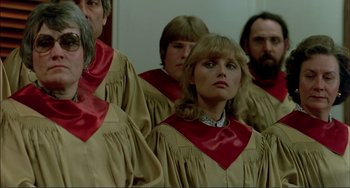 Movie still from “Tender Mercies” (1983), directed by Bruce Beresford – A group of people in choir robes standing in a line; Close Up shot, High angle