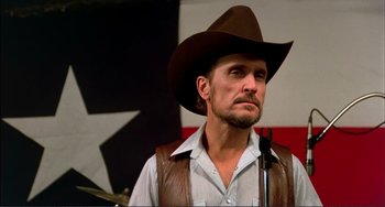 Movie still from “Tender Mercies” (1983), directed by Bruce Beresford – A man in a cowboy hat and a brown hat; Close Up shot, Low angle