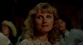 Movie still from “Tender Mercies” (1983), directed by Bruce Beresford – A person with curly hair; Close Up shot, Over the shoulder angle