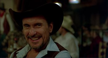 Movie still from “Tender Mercies” (1983), directed by Bruce Beresford – A person wearing a cowboy hat; Close Up shot, Over the shoulder angle