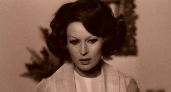 Movie still from “Teorema” (1968), directed by Pier Paolo Pasolini – A person wearing a white shirt; Close Up shot, High angle