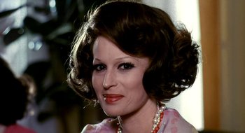 Movie still from “Teorema” (1968), directed by Pier Paolo Pasolini – A person wearing a necklace; Close Up shot, Low angle