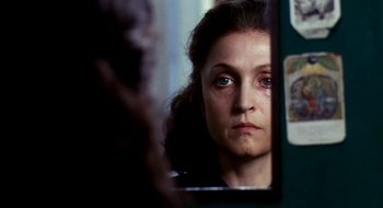 Movie still from “Teorema” (1968), directed by Pier Paolo Pasolini – A person in a mirror; Close Up shot, Over the shoulder angle