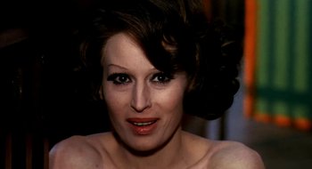 Movie still from “Teorema” (1968), directed by Pier Paolo Pasolini – A person wearing a dress; Close Up shot, Over the shoulder angle