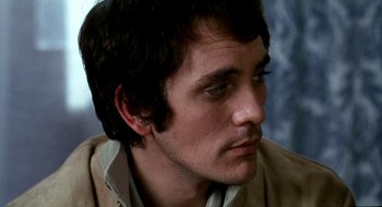 Movie still from “Teorema” (1968), directed by Pier Paolo Pasolini – A person wearing a jacket; Close Up shot, High angle