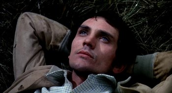 Movie still from “Teorema” (1968), directed by Pier Paolo Pasolini – A person laying on the ground; Close Up shot, High angle