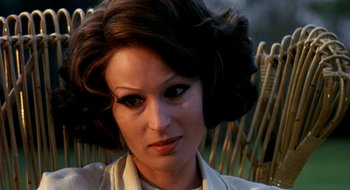 Movie still from “Teorema” (1968), directed by Pier Paolo Pasolini – A person wearing a white shirt; Close Up shot, Over the shoulder angle