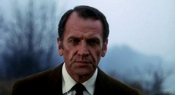 Movie still from “Teorema” (1968), directed by Pier Paolo Pasolini – An older man wearing a suit and a tie; Close Up shot, Low angle