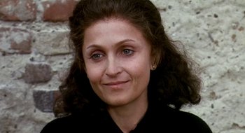 Movie still from “Teorema” (1968), directed by Pier Paolo Pasolini – A person wearing a black shirt; Close Up shot, Over the shoulder angle